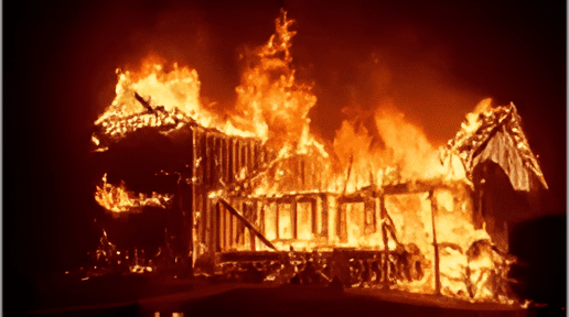 A fire burning in the middle of a building.