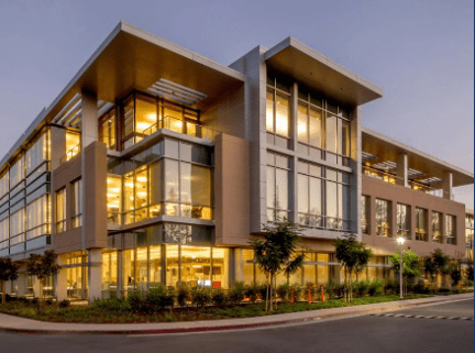 A building with many windows and lights on it